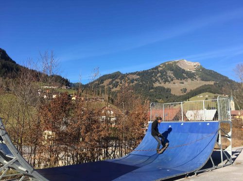 Mike is skateboarding in the Alps