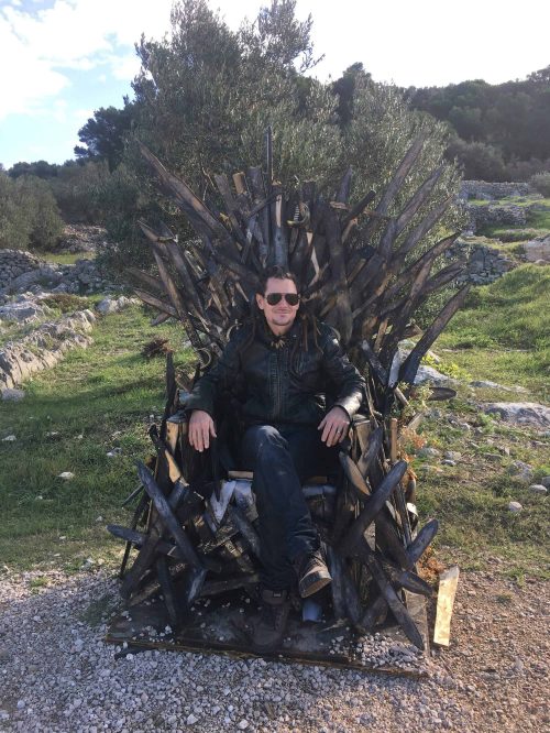 Mike on a throne on the beach