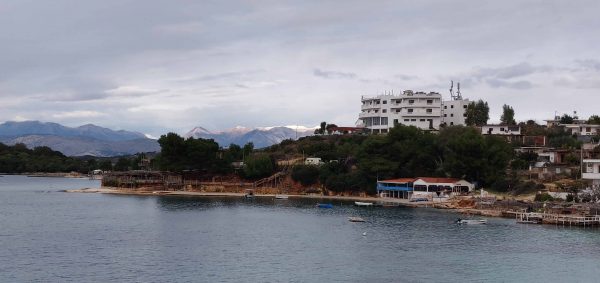 Ksamil and snowy mountains in the background