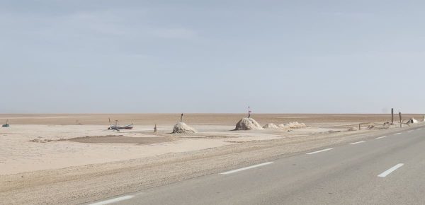 A boat and piles of salt at Chott el Djerid